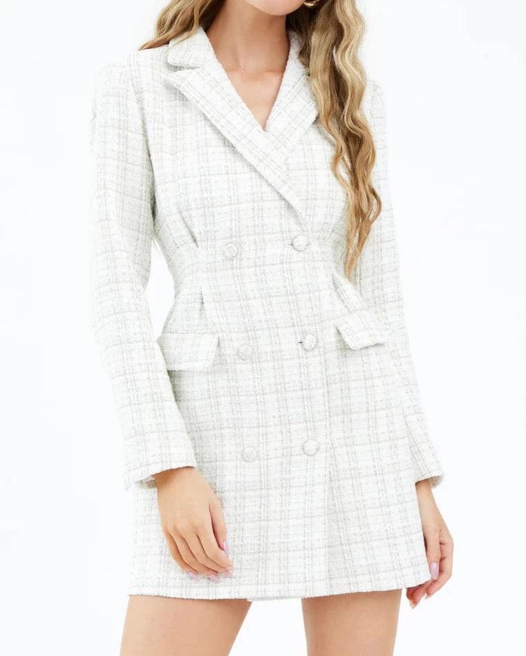 Model presenting the Juliane Tweed Cinched Blazer Dress by Adelyn Rae, featuring a tailored, double-breasted silhouette in a textured white tweed fabric, perfect for a professional yet fashionable appearance - BTK COLLECTION
