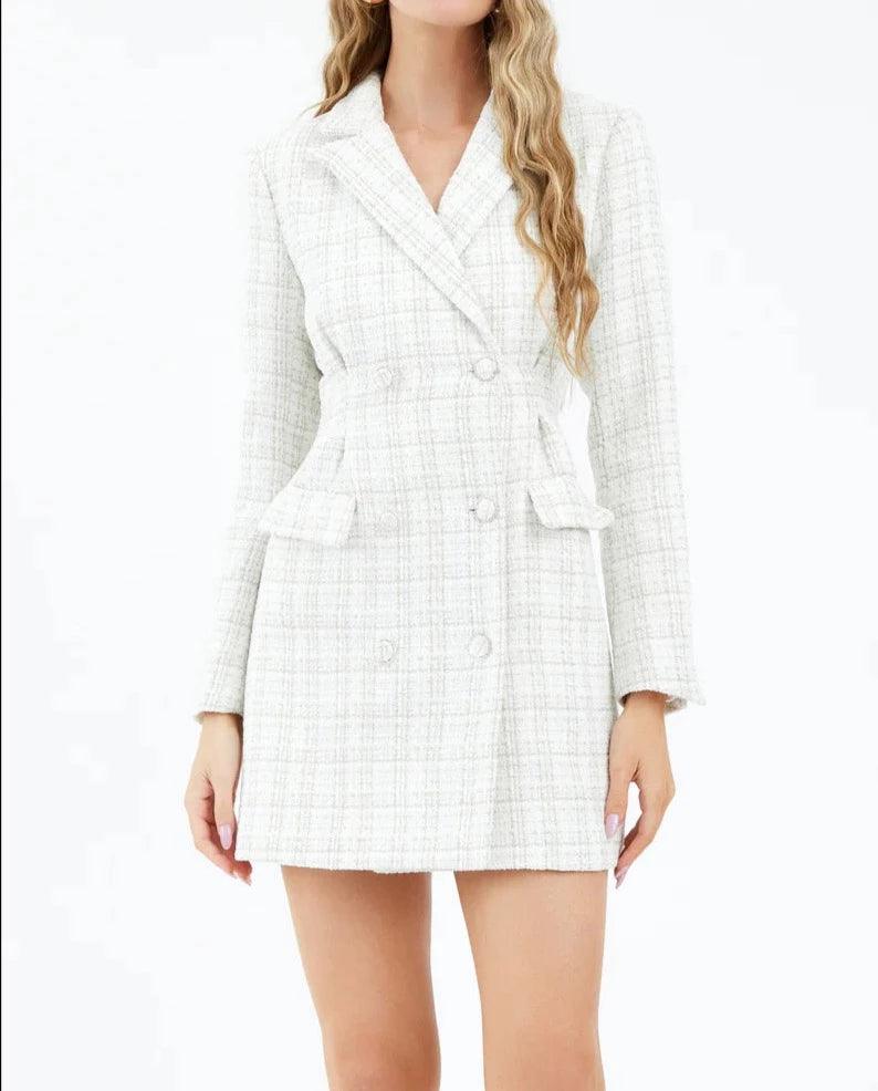 Model presenting the Juliane Tweed Cinched Blazer Dress by Adelyn Rae, featuring a tailored, double-breasted silhouette in a textured white tweed fabric, perfect for a professional yet fashionable appearance- BTK COLLECTION
