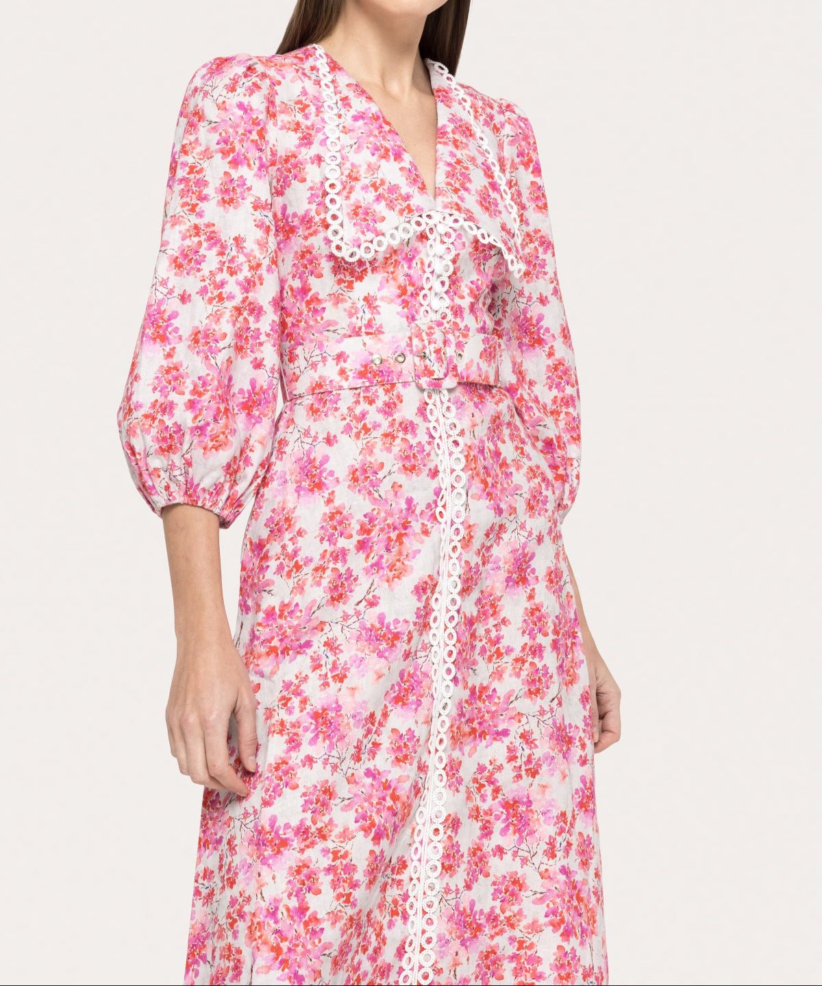 Detail of pink floral linen dress with scalloped white lace trim and tailored belted waist by NISSA - BTK COLLECTIONS