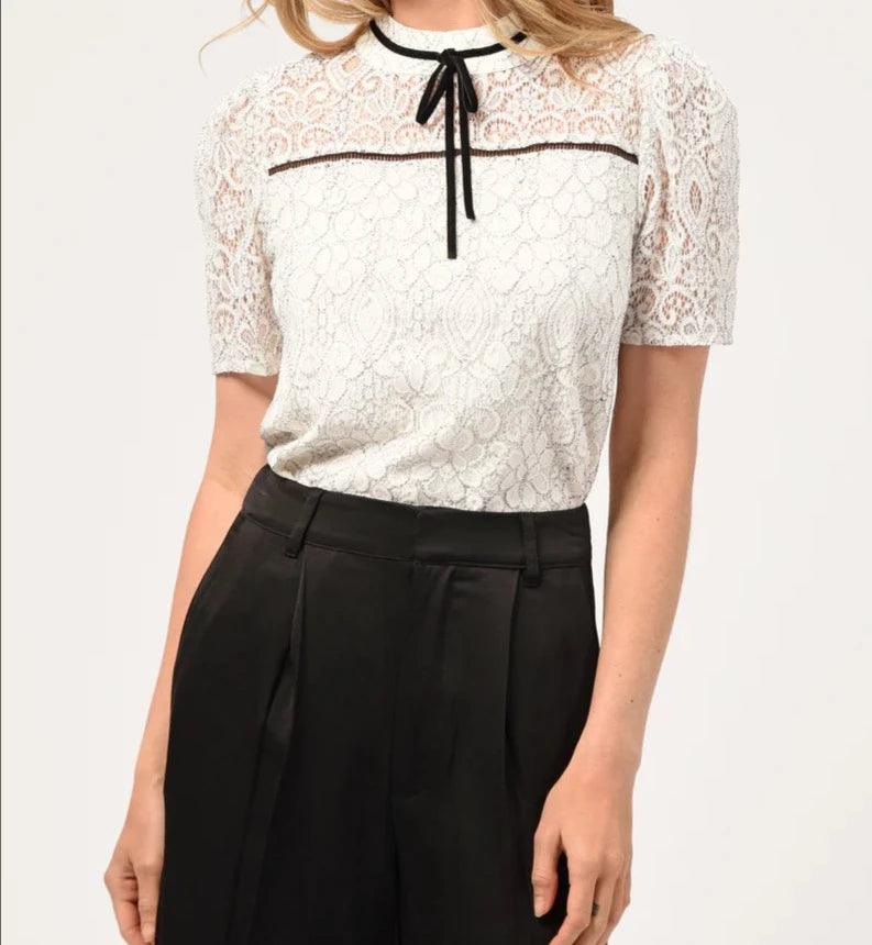 Adelyn Rae Nelli puff sleeve lace top with high neck and black ribbon detail