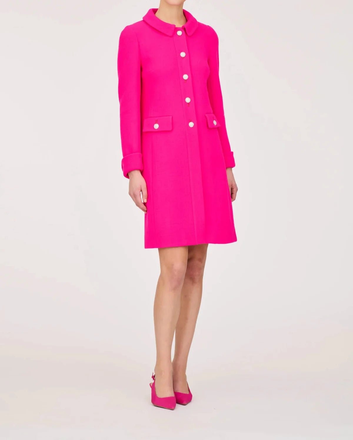 Full-length front view of the Weill Paris hot pink wool jacket, showing its gently flared shape and above-knee hem.