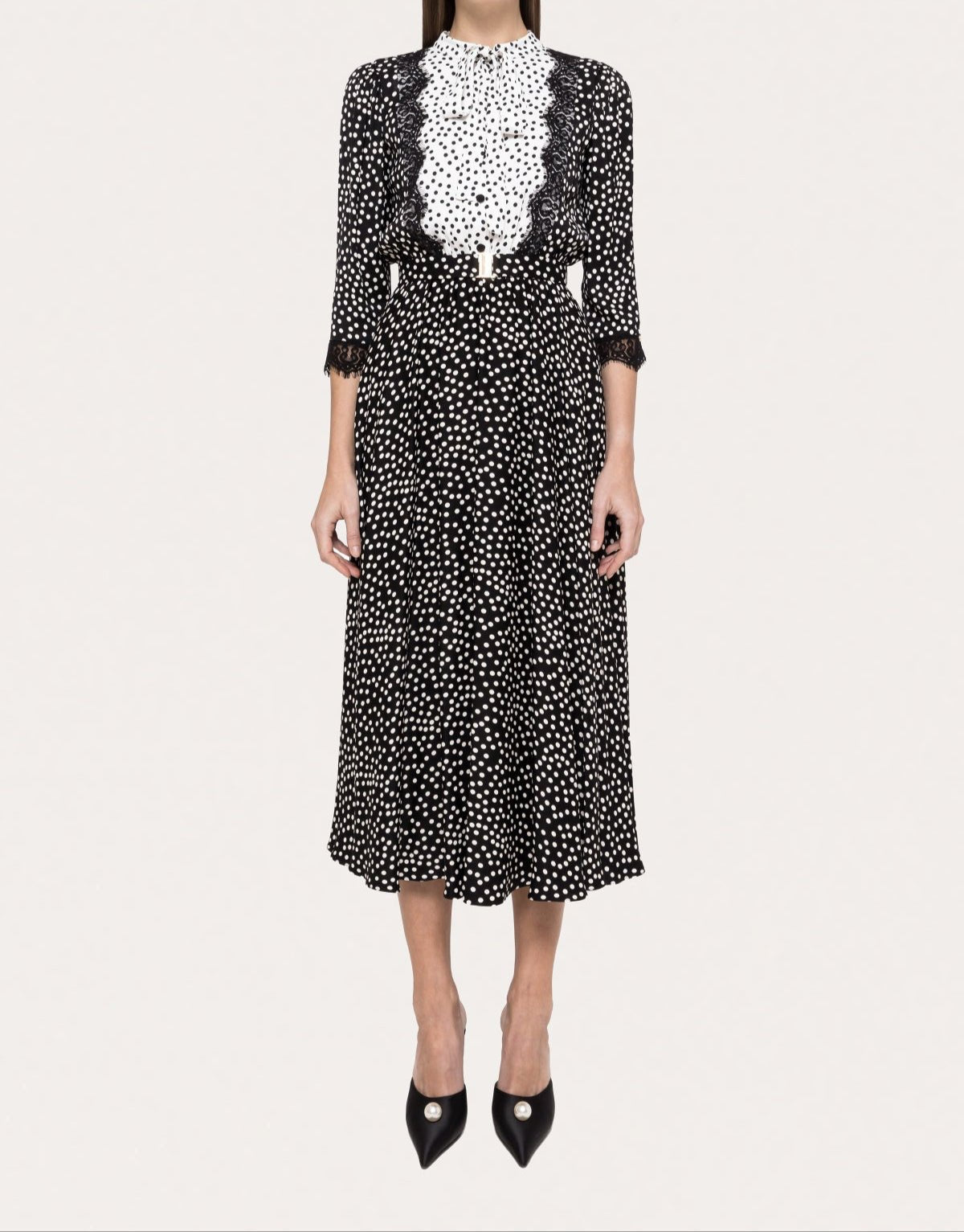 Black and white polka dot midi dress with contrast scalloped lace bib front, 3/4 sleeves, and vintage-inspired silhouette.