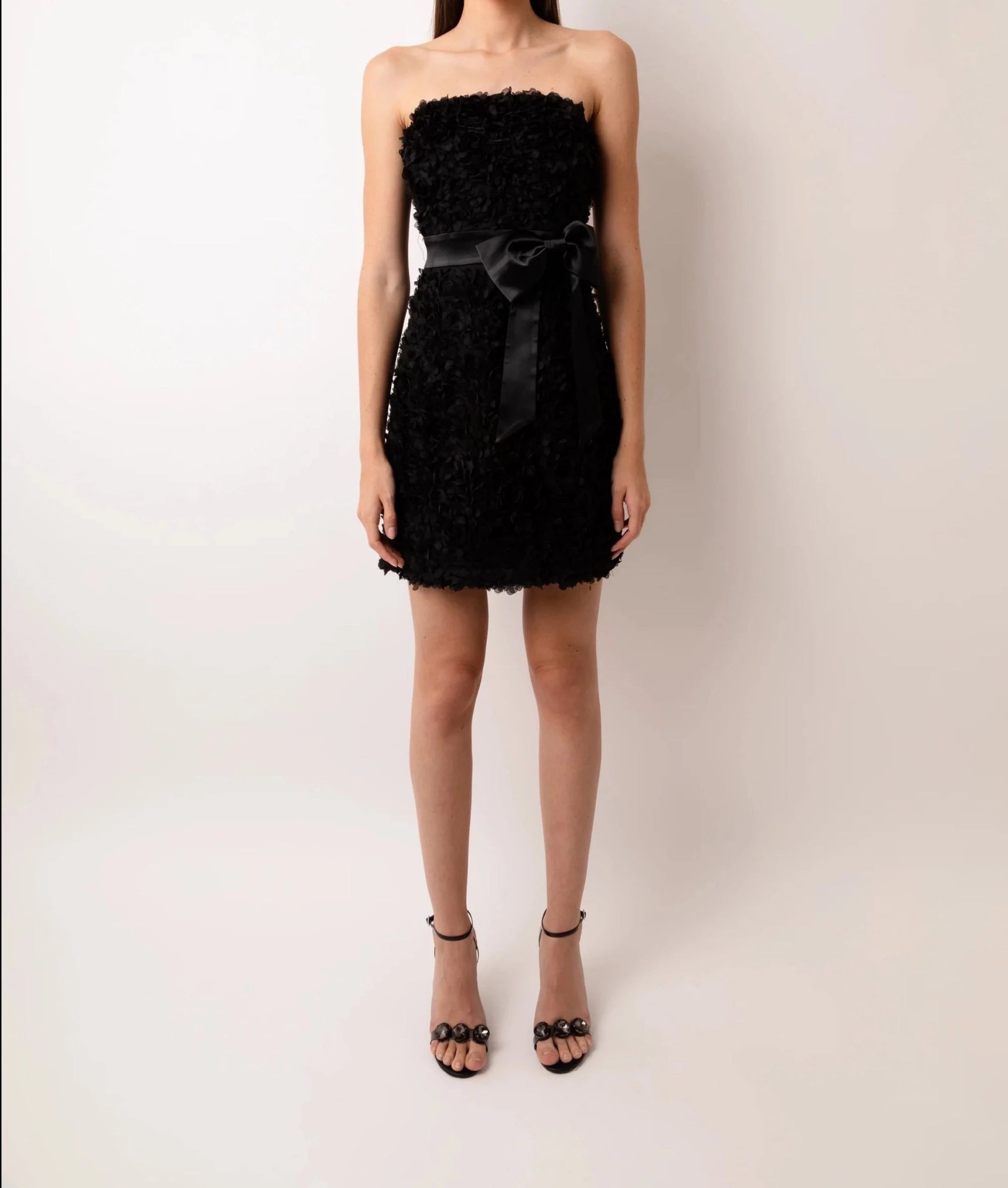 Black strapless textured bow detail mini dress with bandeau neckline by Amy Lynn