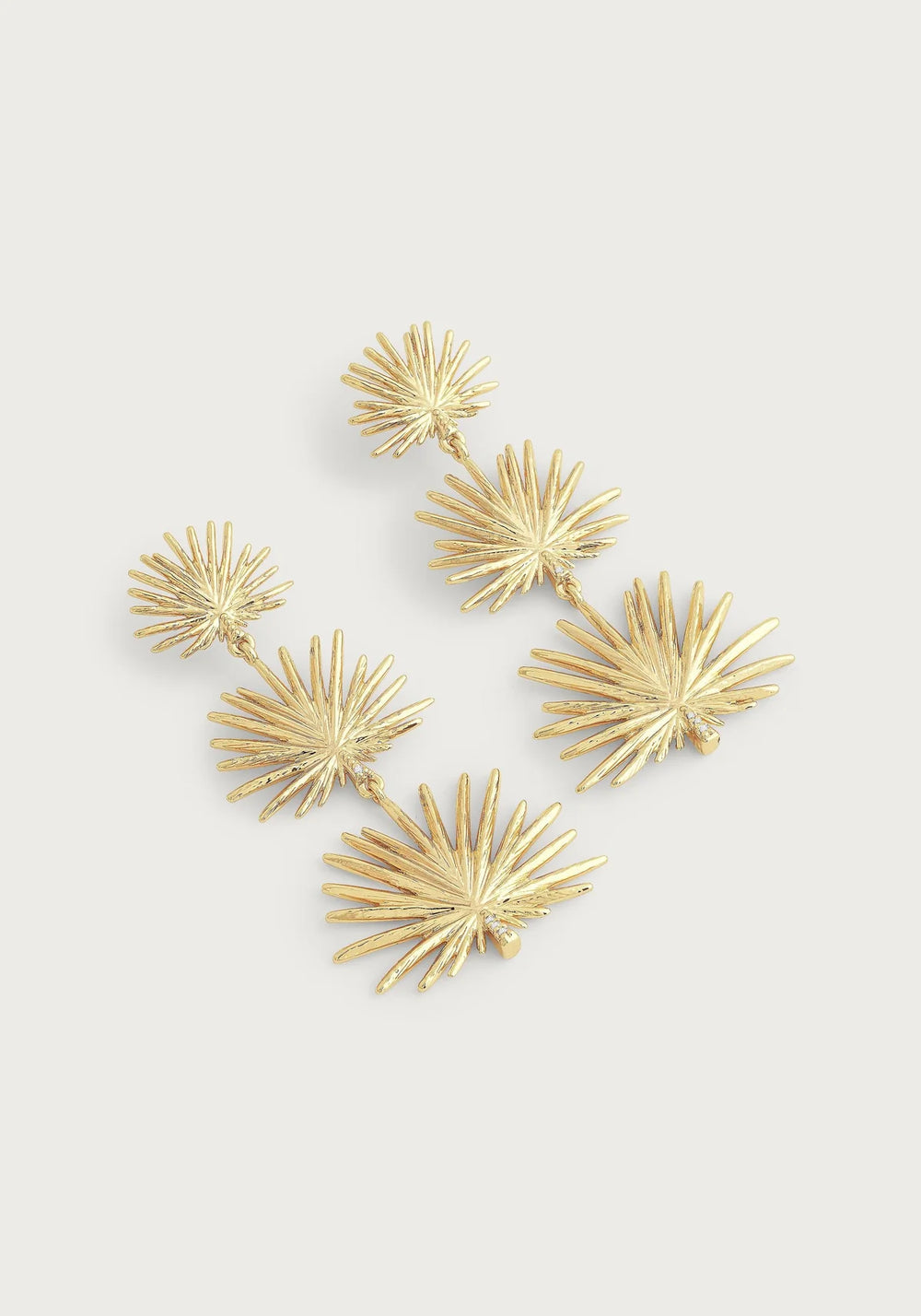 Small triple fan palm dangle earrings featuring three ascending gold‑tone fan palm leaf motifs cascading downward, crafted from 18K gold‑plated brass