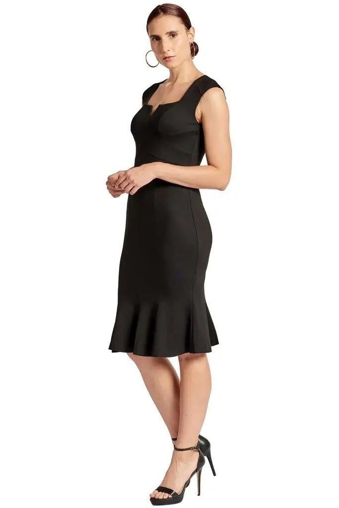 Three-quarter front view of the Simona Maghen Ivy black sleeveless dress showing the fitted waist and flared hem.