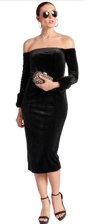 Joia black velvet off-the-shoulder midi dress styled with sunglasses, a patterned clutch and black strappy heels.