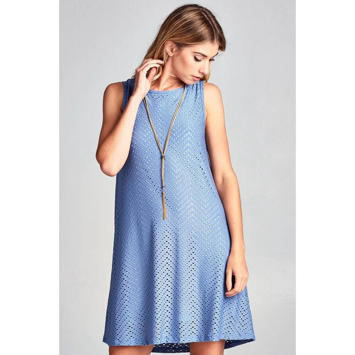 Close-up of the blue Renee C mini dress showing chevron eyelet texture and a round neckline.