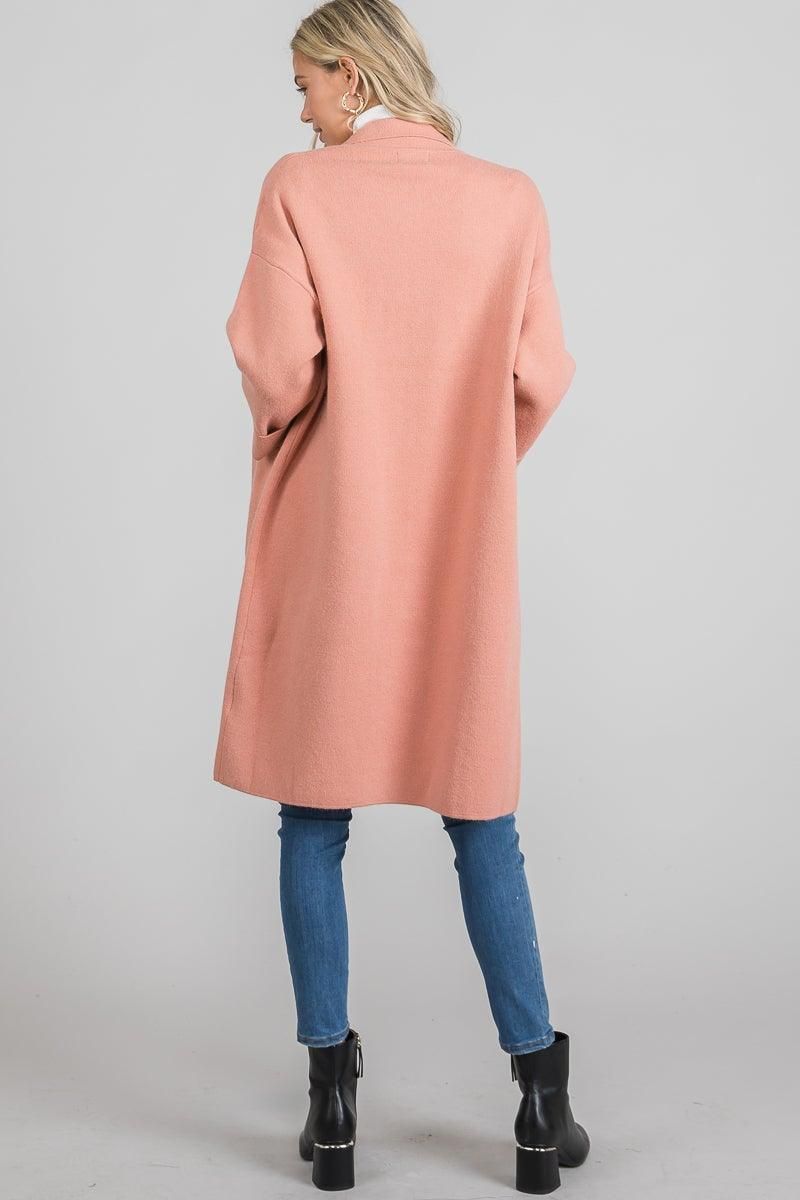 Knee-length dusty mauve coat with an open front, classic collar, and roomy patch pockets by Allie Rose.