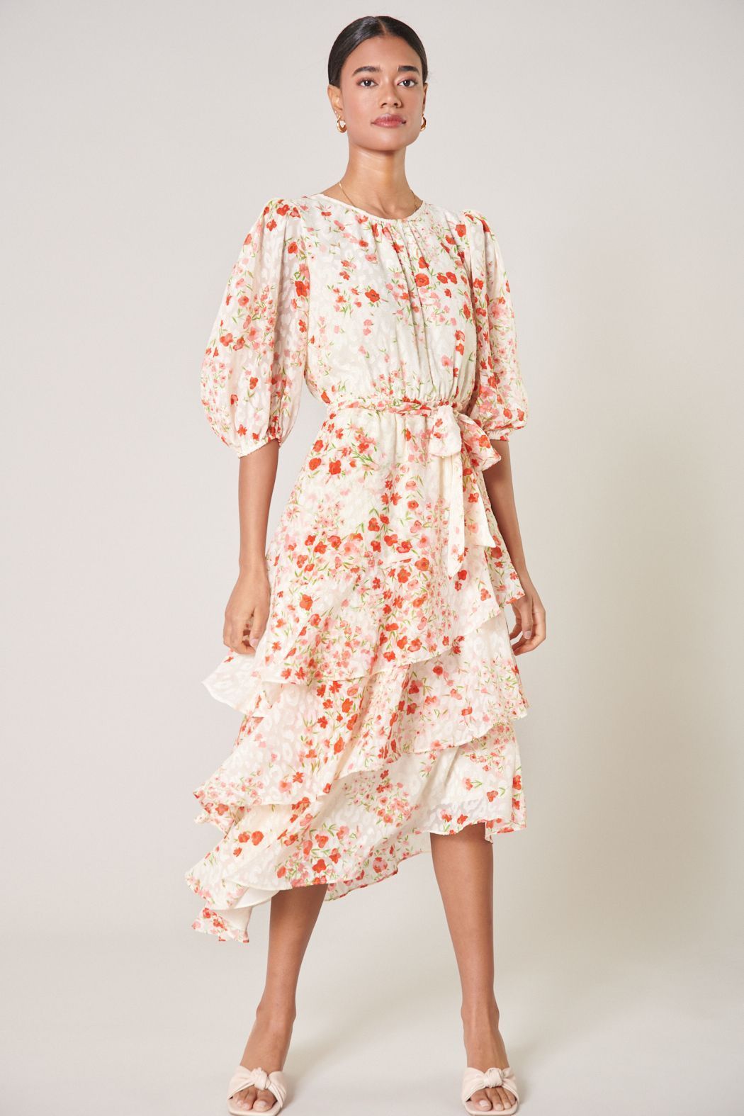 Blush floral asymmetrical ruffle midi dress with puff sleeves front view